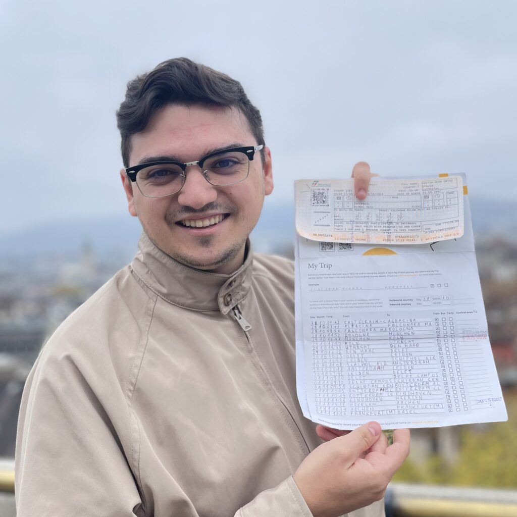 A man displaying a foldable piece of paper with joy