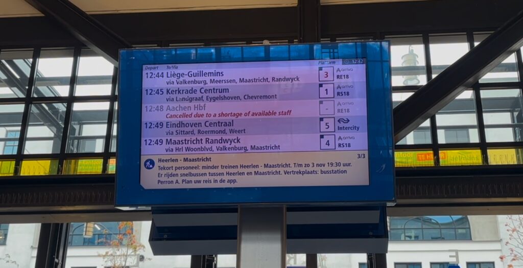 A train station display board